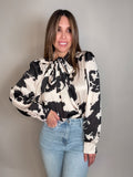 Style the Cow Print Tie Collar One Size Top exclusively at Born To Glam