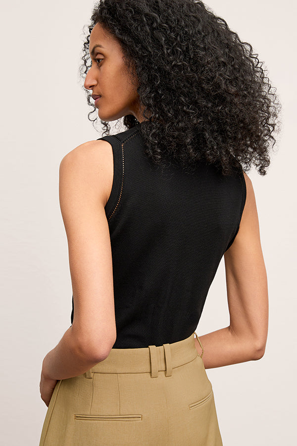 image of a woman wearing the crimmins top in black | Exclude  | Grid Hover