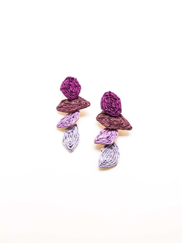 Pair of textured drop earrings with layered purple, mauve, and lilac stacked shapes on a white background.