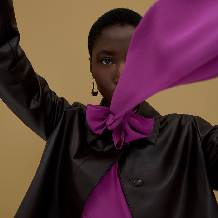 Front image of a woman wearing the Darcy Top in Purple Jasper