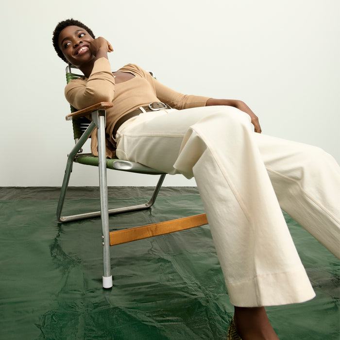 image of a woman wearing the delphine top in camel