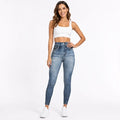 Women's denim yoga leggings in Classic Blue, front studio view with model for activewear and everyday outfit styling.
