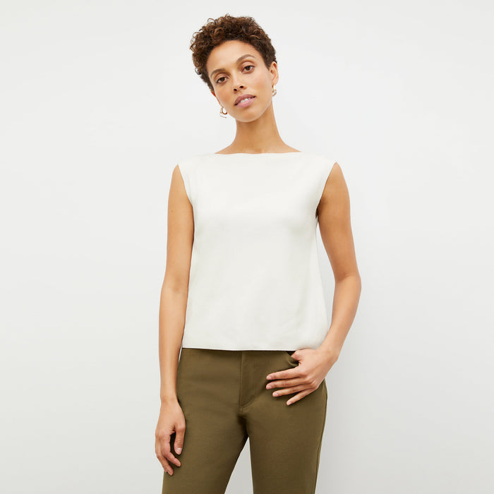 Front image of a woman standing wearing the Eileen Top in ivory | Lead