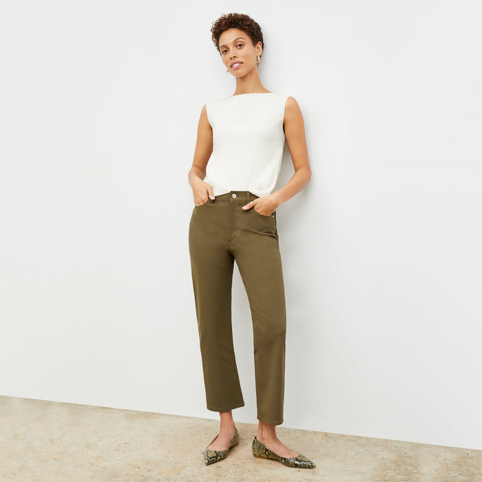 Front image of a woman standing wearing the Eileen Top in ivory