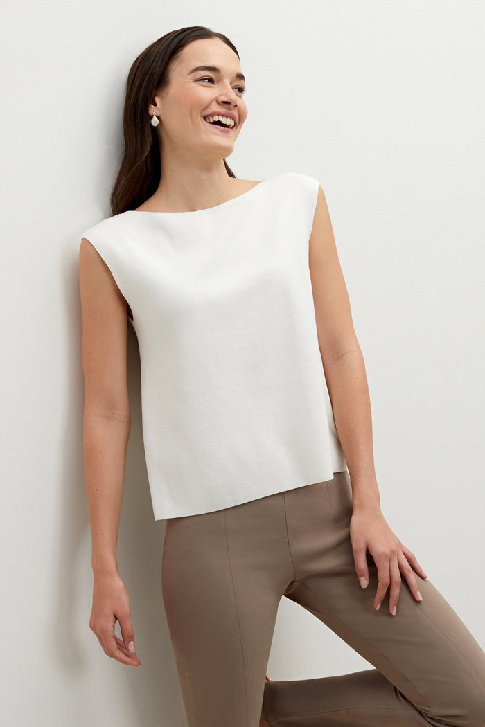 Front image of a woman standing wearing the Eileen top in ivory | Exclude
