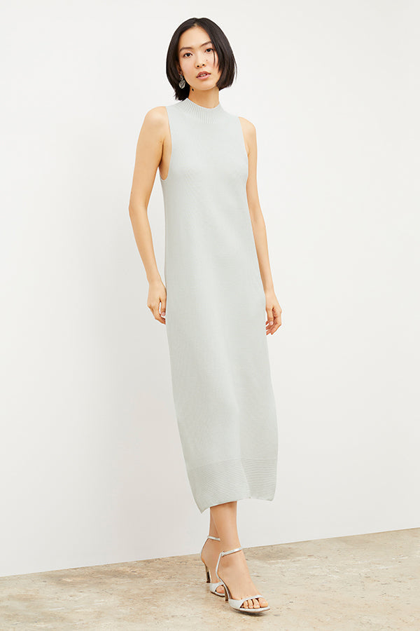 Woman standing wearing the Ella Sandal in Silver | Grid Hover | Exclude
