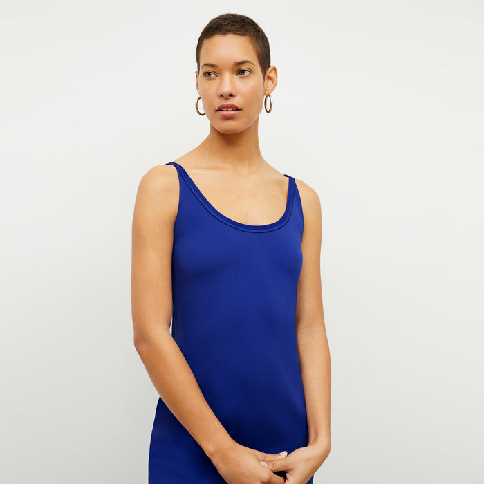 front image of a woman wearing the elsa dress in electric blue