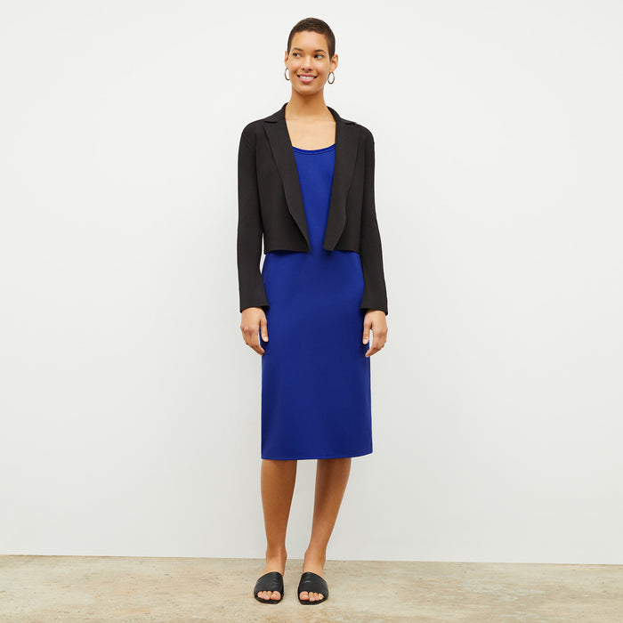 front image of a woman wearing the elsa dress in electric blue