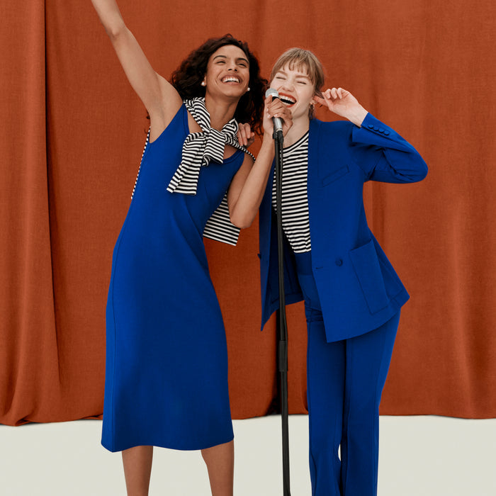 front image of a woman wearing the elsa dress in electric blue