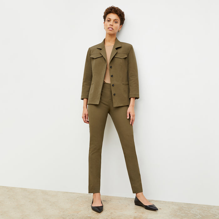 Front image of a woman in the emalis jacket in oregano