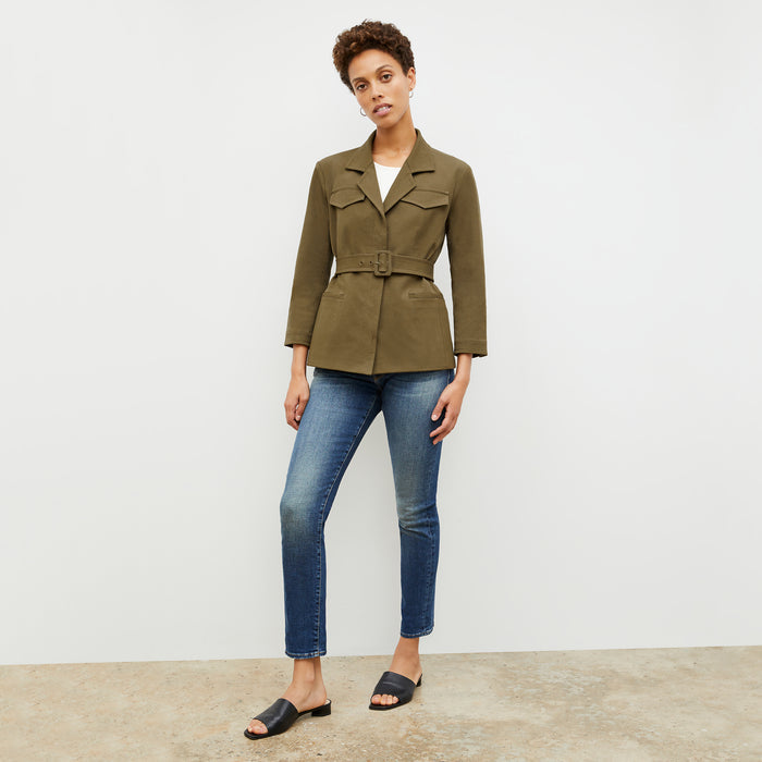 Front image of a woman in the emalis jacket in oregano