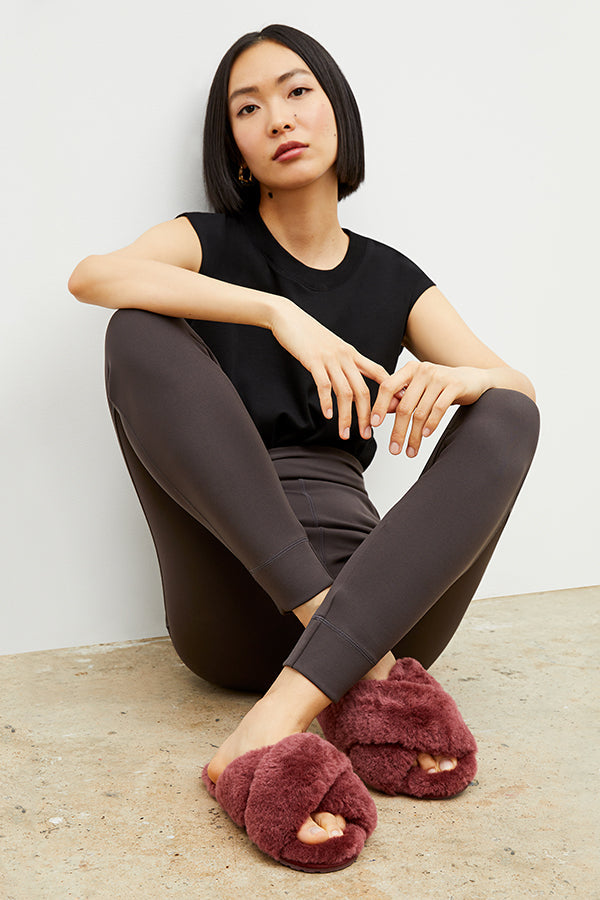 Front image of a woman wearing the emu slipper in merlot | Exclude | Grid Hover