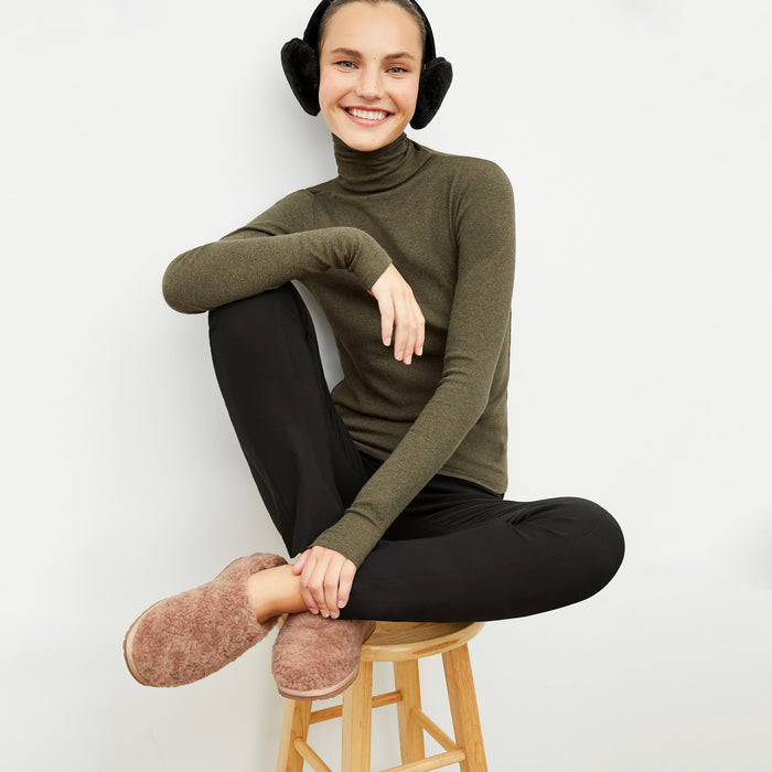 Front image of a woman wearing the emu slipper in natural