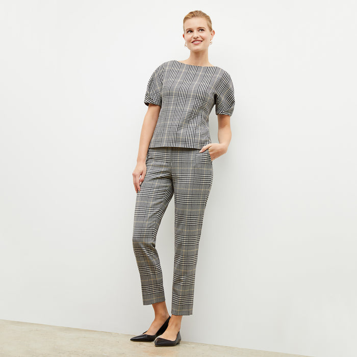 Front image of a woman wearing the eudora top in plaid sharkskin