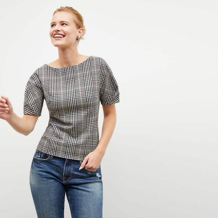 Front image of a woman wearing the eudora top in plaid sharkskin