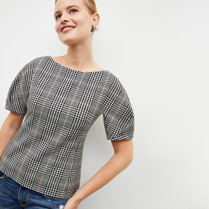 Front image of a woman wearing the eudora top in plaid sharkskin