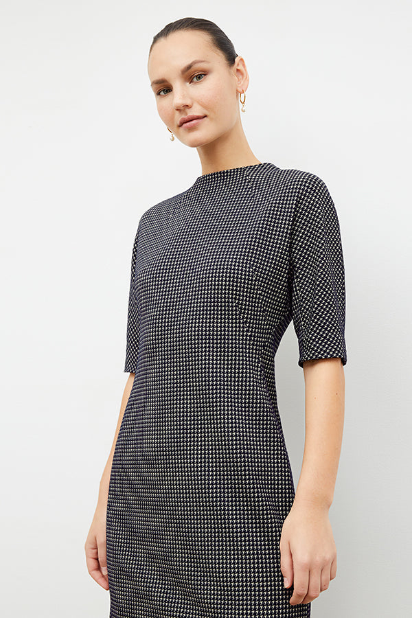 Front image of a woman wearing the farnoosh dress in black and white houndstooth | Exlude | Grid Hover