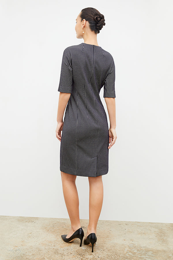 Back image of a woman wearing the farnoosh dress in black and white houndstooth | Exclude