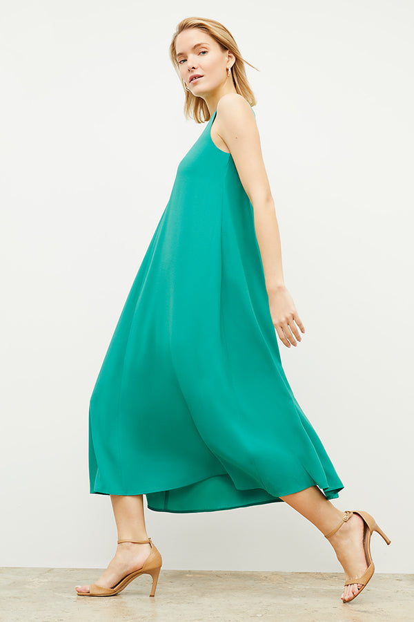 Side image of a woman wearing the Fatima Dress - Eco Heavy Crepe in Tropical Green | Grid Hover | Exclude