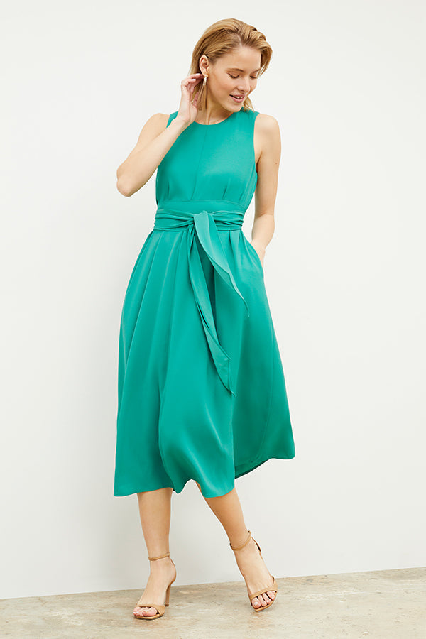 Front image of a woman wearing the Fatima Dress - Eco Heavy Crepe in Tropical Green | Grid | Exclude