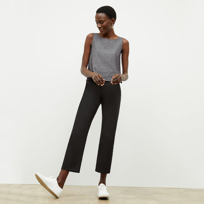 front image of a woman wearing the flaka top in gingham linen