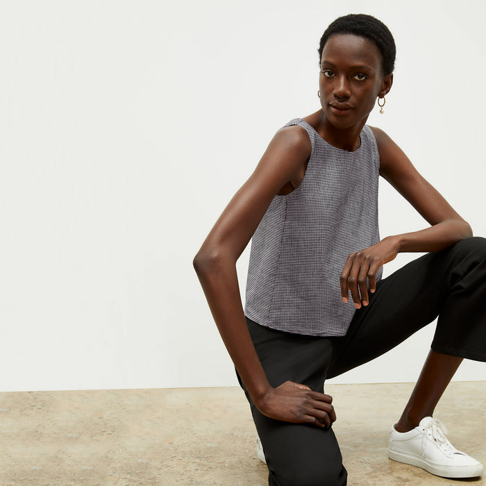 front image of a woman wearing the flaka top in gingham linen