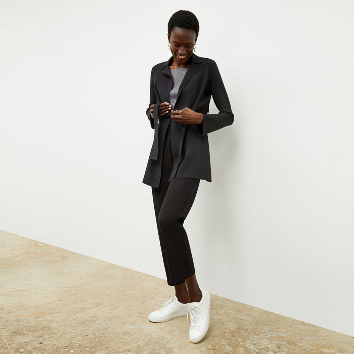 front image of a woman wearing the flaka top in gingham linen