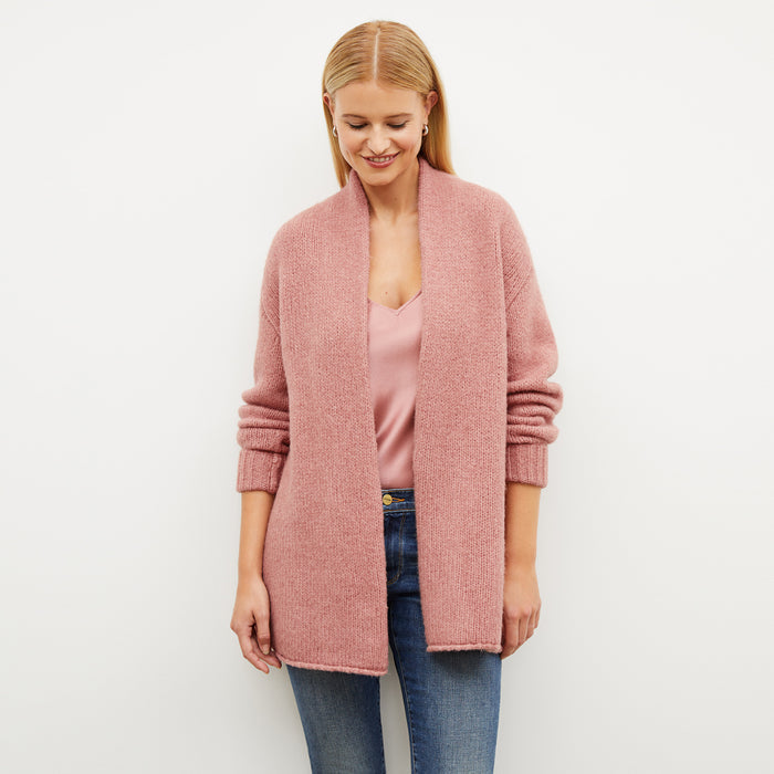 Front image of a woman wearing the frederick cardigan in himilayan salt