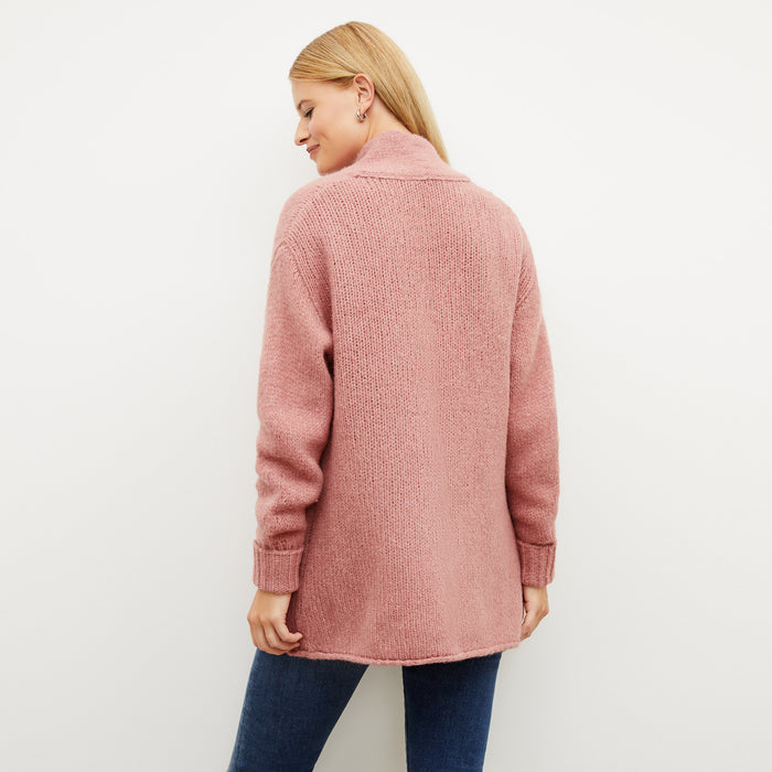 Back image of a woman wearing the frederick cardigan in himilayan salt