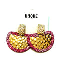 Fuschia crystal statement earring with a textured hammered gold semi-circle design and bold jewel-tone accent.