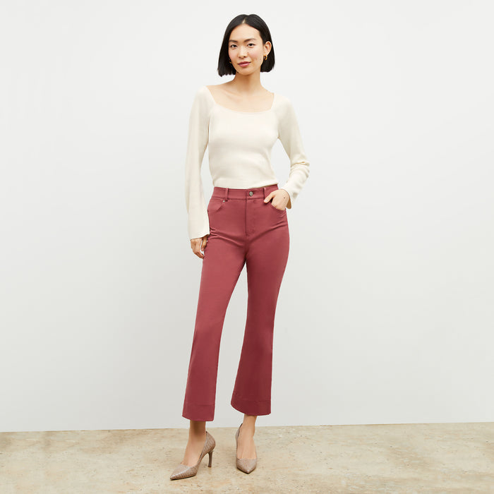 Front image of a woman wearing the ginger pump in rosy taupe
