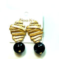 Gold and black clip-on drop earring with a textured gold metallic finish and bold black bead accent.