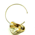 Gold-tone collar necklace with a large sculptural pendant and polished metallic shine.