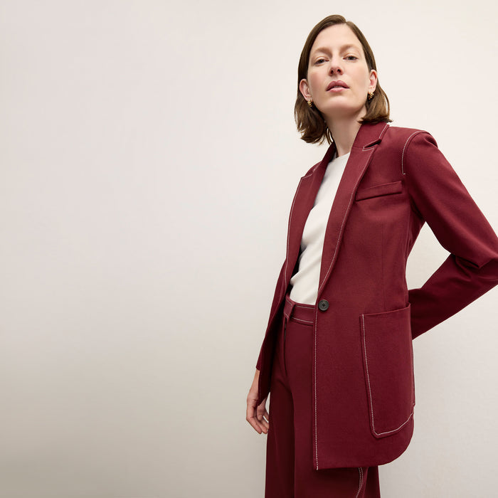 front image of a woman wearing the grenville jacket in berry jam | Lead