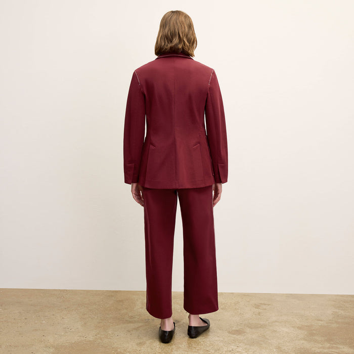 back image of a woman wearing the grenville jacket in berry jam