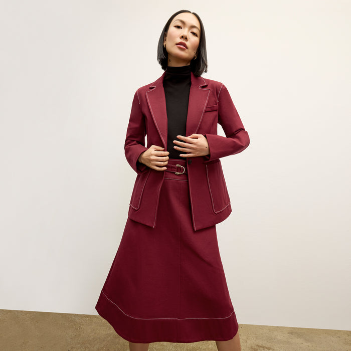 front image of a woman wearing the grenville jacket in berry jam