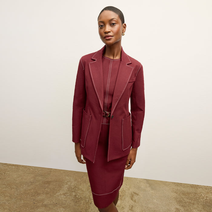 front image of a woman wearing the grenville jacket in berry jam
