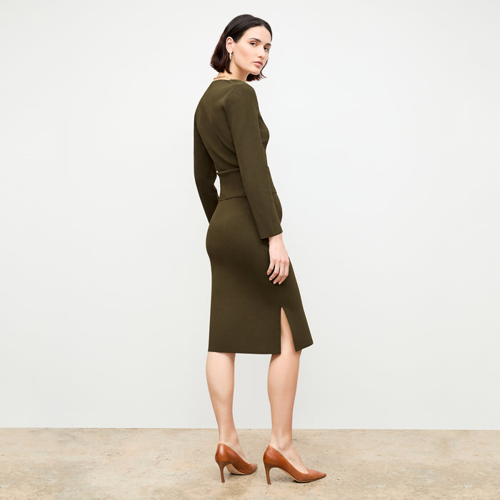 back image of a woman wearing the harlem skirt in dark elm