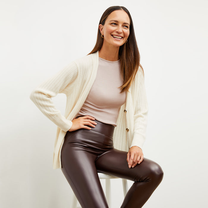 Front image of a woman wearing the harrington in brown