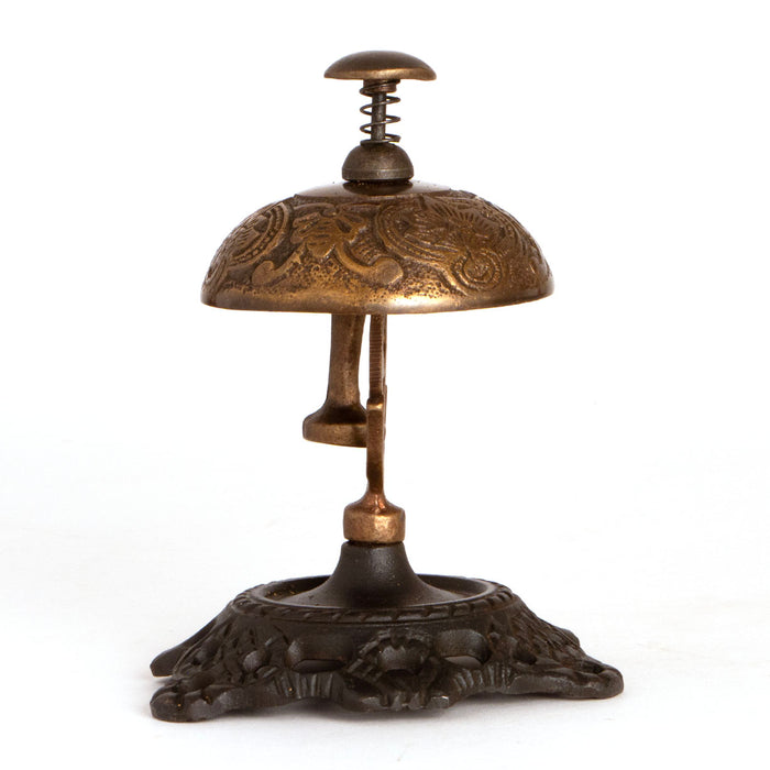 old fashioned hotel desk bell with spring loaded button, solid brass bell and iron base