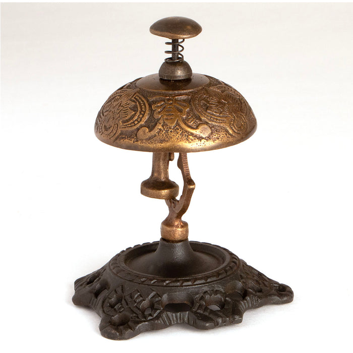 old fashioned hotel desk bell with spring loaded button, solid brass bell and iron base