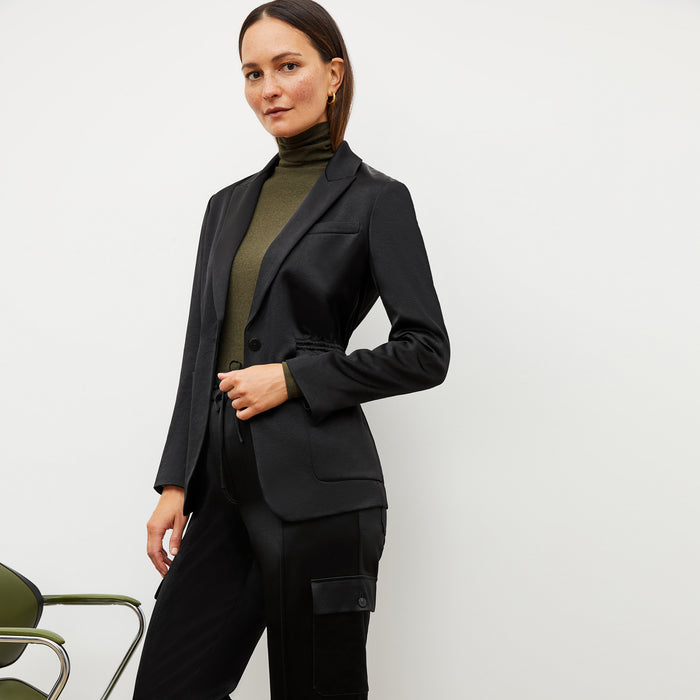 Image of a woman wearing the Hyo Jacket in Black