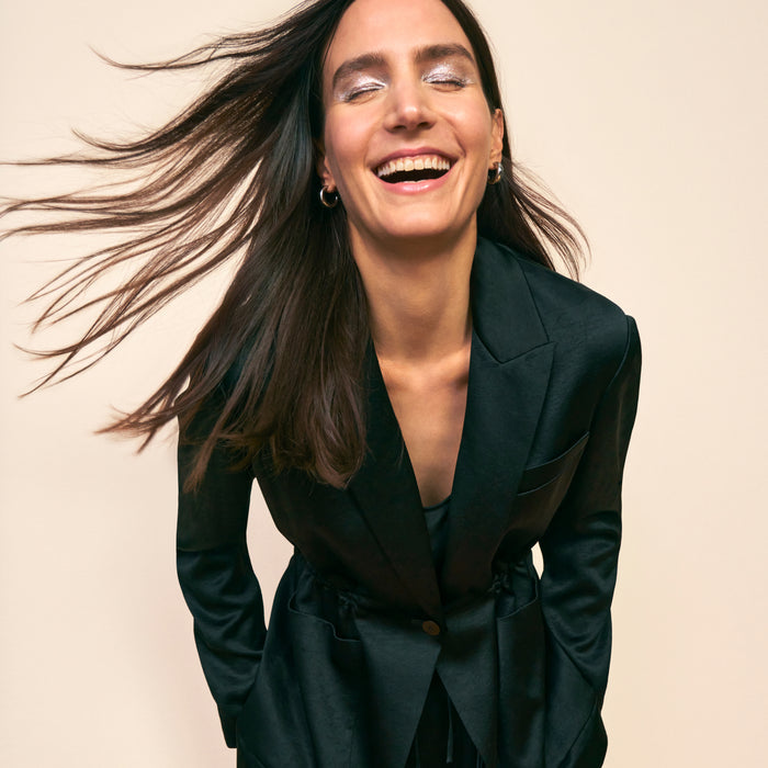 mood image of a woman wearing the hyo jacket in black