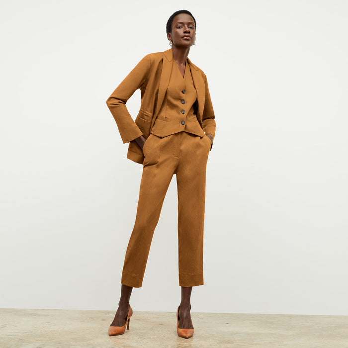 Front image of a woman wearing the Hyo Jacket in Acorn