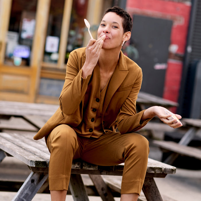 Front image of a woman wearing the Hyo Jacket in Acorn