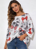 Women's graphic knit sweater featuring a multicolor Yorkie illustration with red bow and glasses accents.