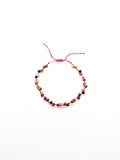 An adjustable tourmaline bracelet with a purple and green tones