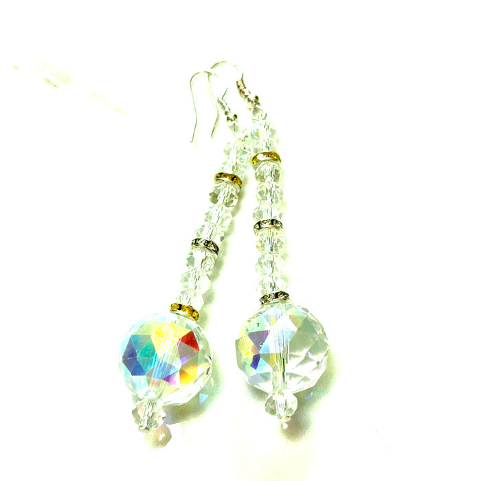 Iridescent and yellow crystal drop earrings with faceted beads and a sterling silver hook post.