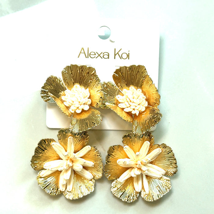Ivory and gold oversized flower statement earrings with sculptural petal detailing and a warm metallic finish.