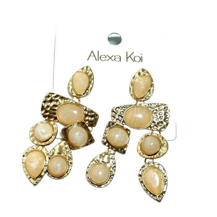 Ivory and hammered gold dangle earring with textured gold detail and a polished boutique jewelry look.